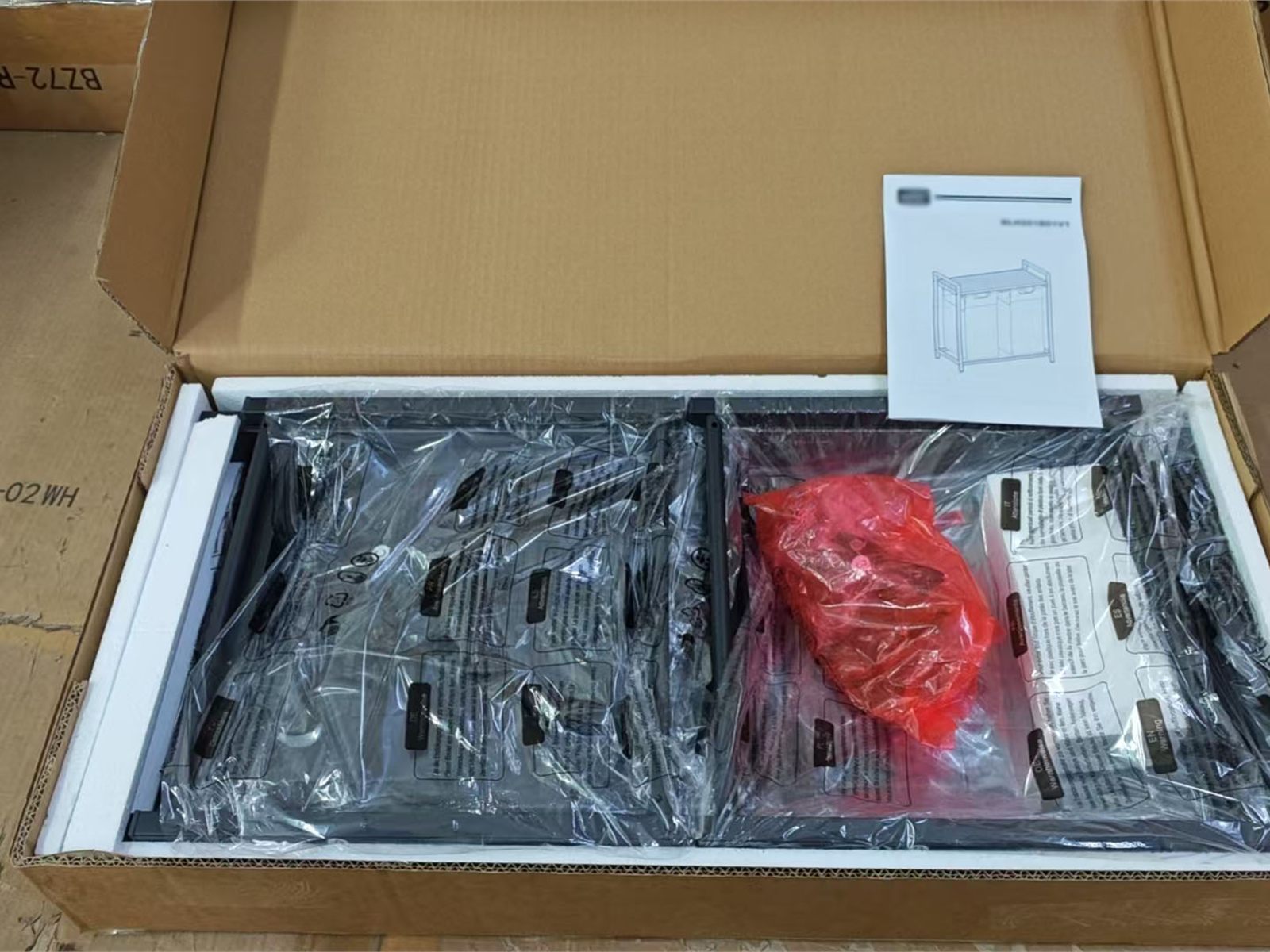 Flat-pack carton with internal protection, packed components and assembly instructions