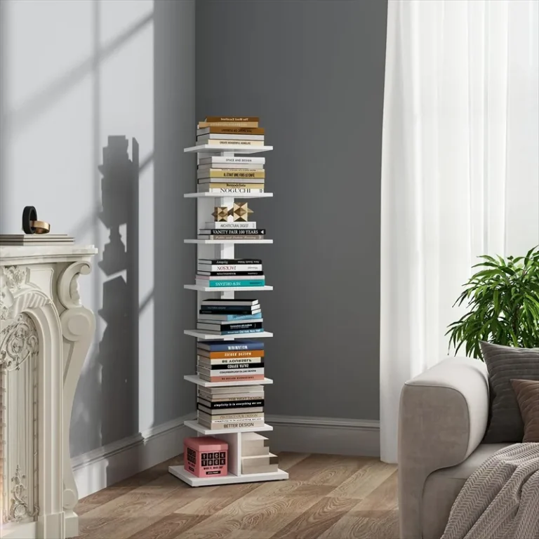 White spine bookcase stacked with books beside a living room curtain