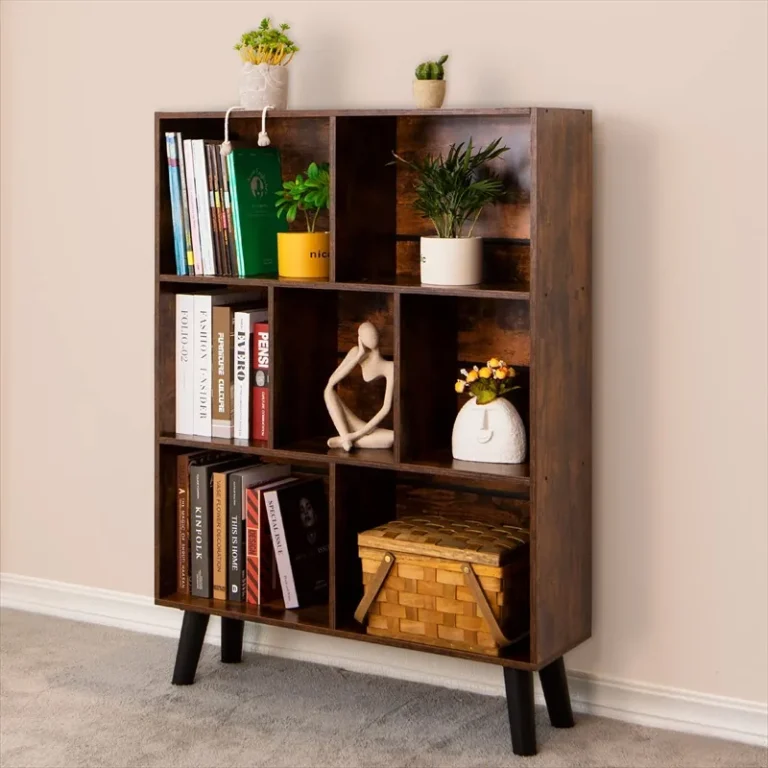 Brown seven-cubby bookcase with plants and books on raised legs