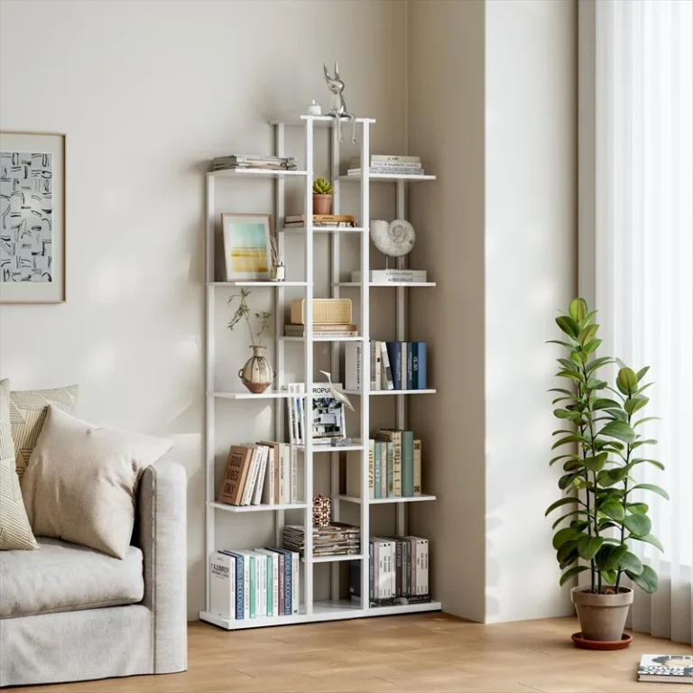 White staggered bookcase displaying books and decorative objects
