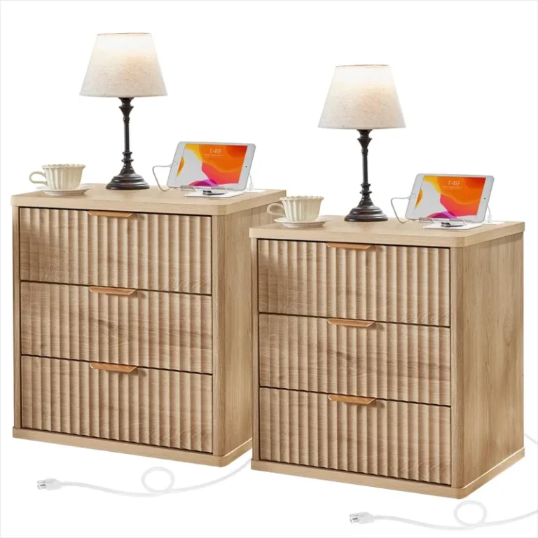 Pair of fluted three-drawer nightstands with lamps and charging cables
