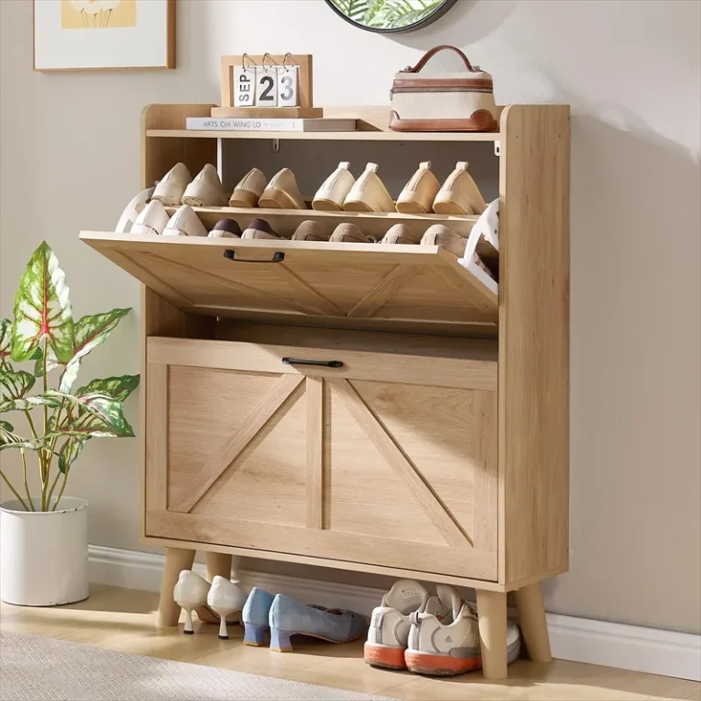 Shoe cabinet with its upper flip-down compartment open and shoes below