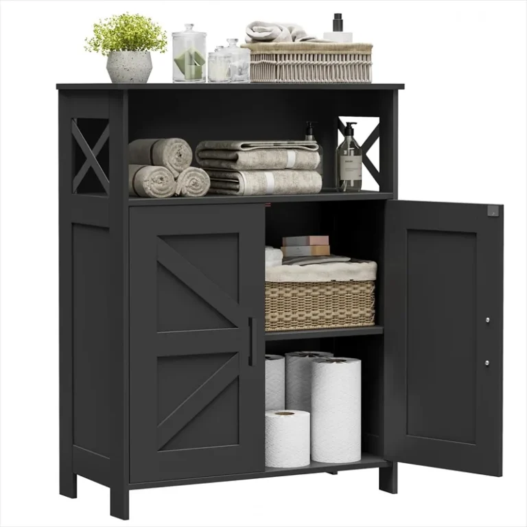 Black bathroom cabinet with one door open and towels on the upper shelf