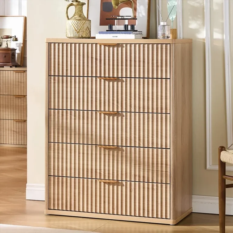 Tall five-drawer chest with fluted fronts and objects on top
