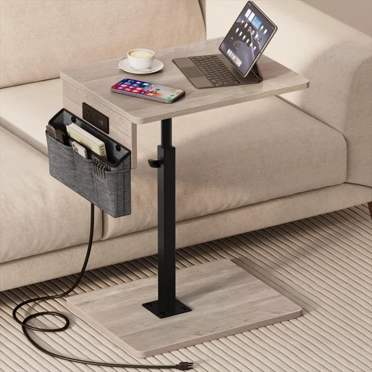 Adjustable swivel table with a side organiser beside a sofa