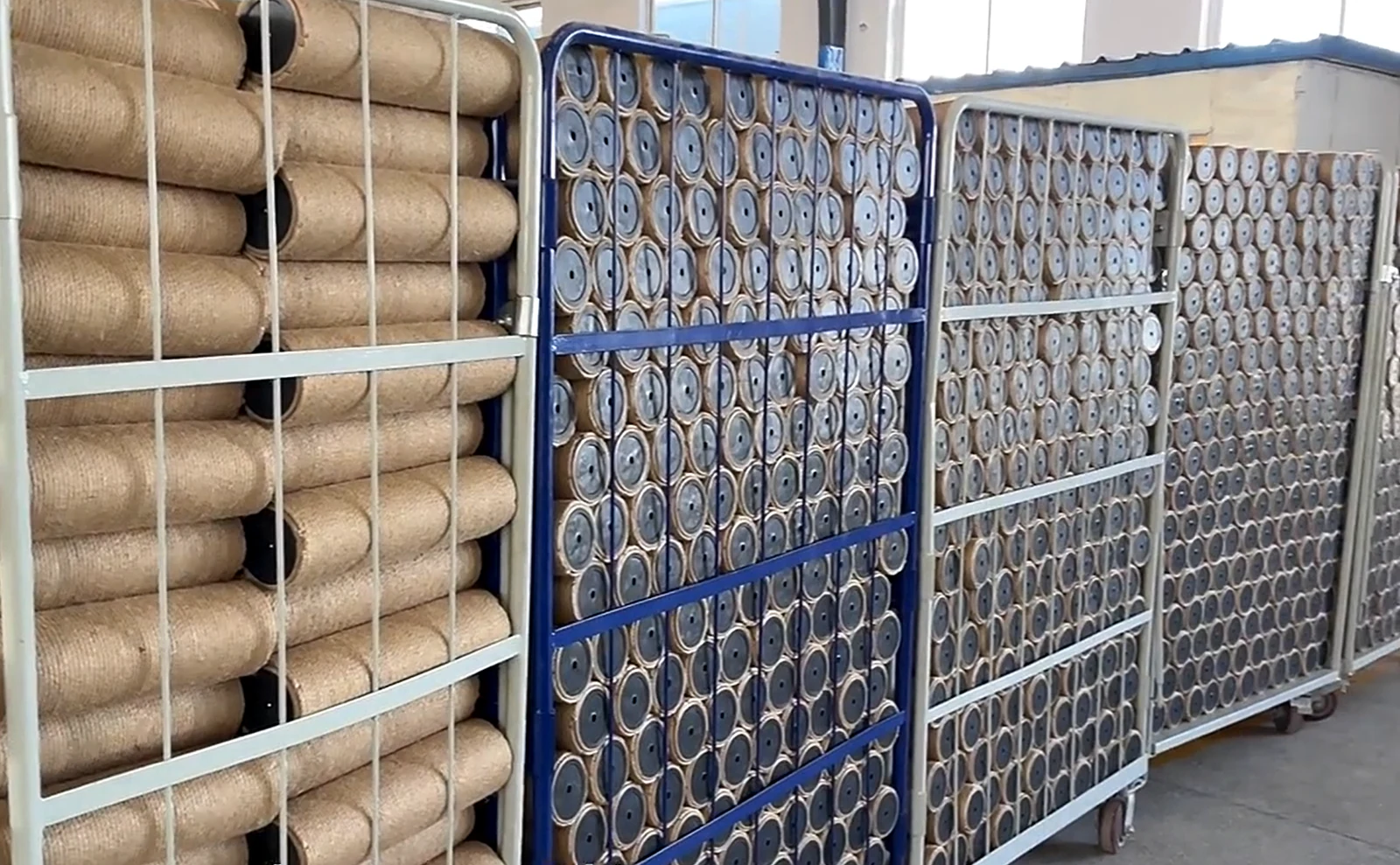 Wrapped cat tree posts stored in warehouse racks