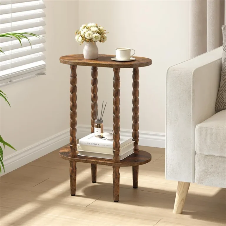 Oval two-tier side table with turned spindle legs and a flower vase