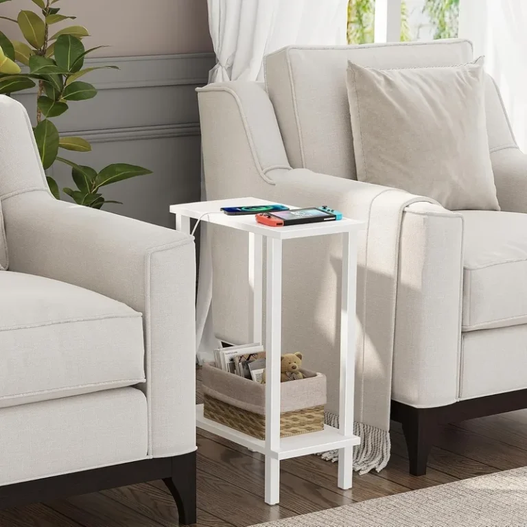 White narrow two-tier side table between upholstered living room seats