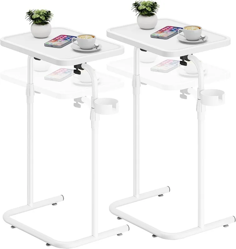 White adjustable C-shaped side tables with raised-edge tops and cup holders