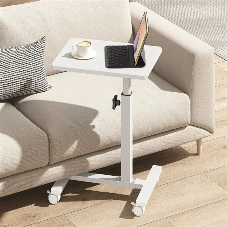 White adjustable C-shaped table on castors beside a sofa